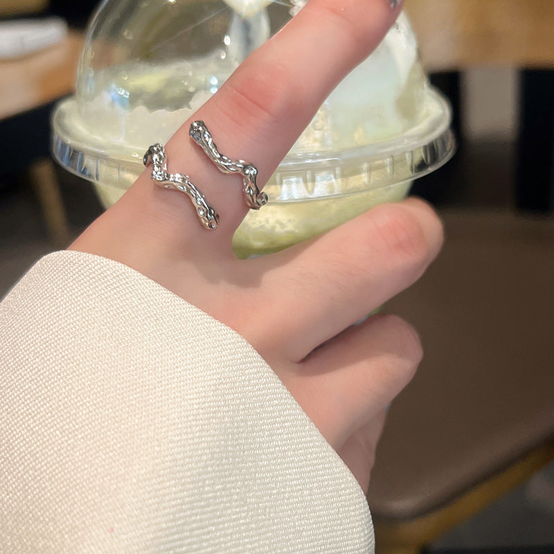 Korean version of the new cold wind irregular niche design metal wave shape girls open index finger ring accessories nugget earrings
